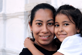 Mother and daughter hugging